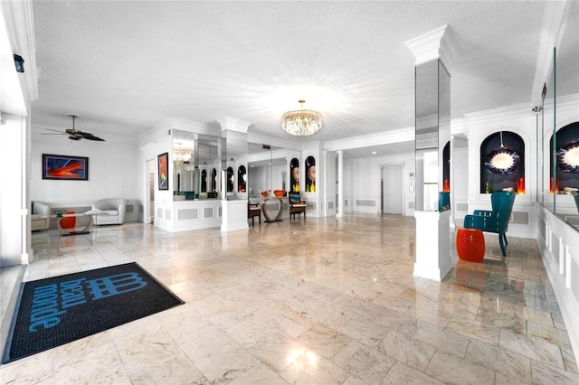 4950 Gulf Blvd Unit 404, St Pete Beach, FL 33706 - lobby with a decorative wall, crown molding, a textured ceiling, and a wainscoted wall