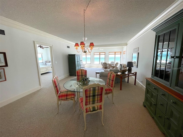 4950 Gulf Blvd Unit 404, St Pete Beach, FL 33706 - dining area featuring ornamental molding, a chandelier, light carpet, and a textured ceiling
