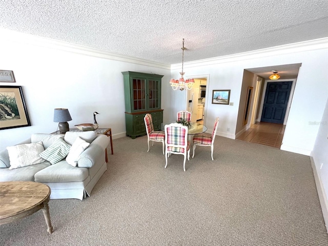 4950 Gulf Blvd Unit 404, St Pete Beach, FL 33706 - carpeted dining space with ornamental molding, a chandelier, and a textured ceiling