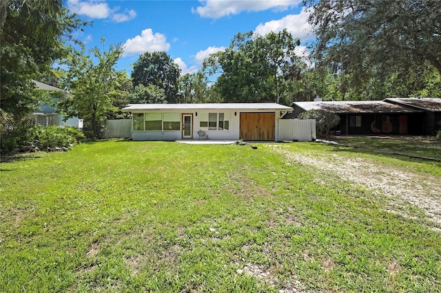8944 W White Dogwood Dr, Homosassa, FL 34448 - rear view of house featuring driveway and metal roof