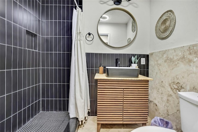 8944 W White Dogwood Dr, Homosassa, FL 34448 - full bathroom with tile walls, tiled shower, toilet, and vanity