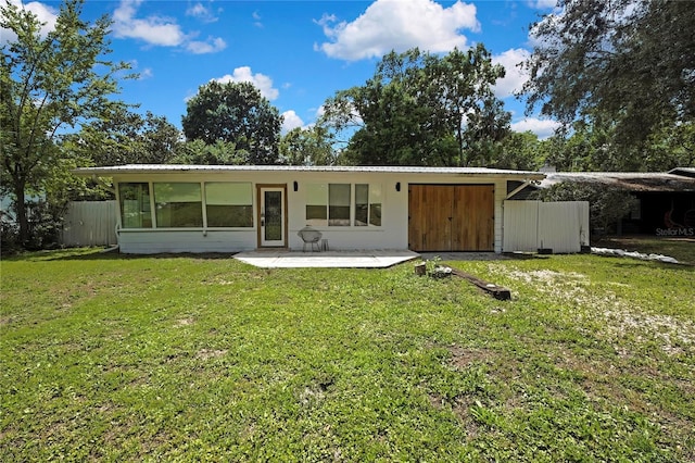8944 W White Dogwood Dr, Homosassa, FL 34448 - rear view of house featuring metal roof and a patio