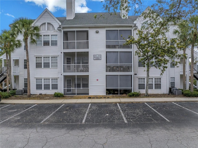 3305 Haviland Ct Unit 101, Palm Harbor, FL 34684 - view of building exterior with uncovered parking