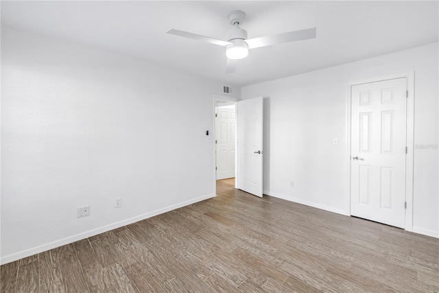 3305 Haviland Ct Unit 101, Palm Harbor, FL 34684 - unfurnished bedroom featuring wood finished floors and a ceiling fan