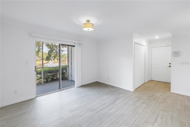 3300 Haviland Ct Unit 103, Palm Harbor, FL 34684 - unfurnished room with light wood-style flooring