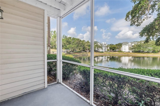 3300 Haviland Ct Unit 103, Palm Harbor, FL 34684 - unfurnished sunroom with a water view
