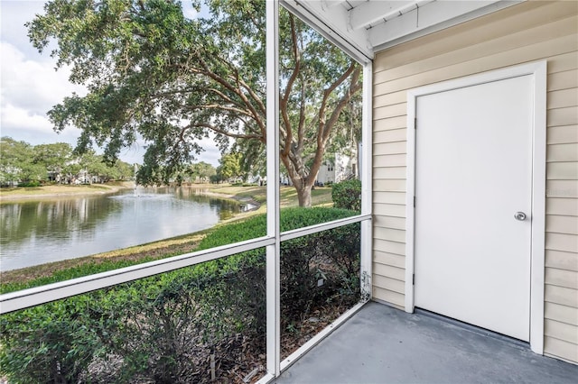 3300 Haviland Ct Unit 103, Palm Harbor, FL 34684 - unfurnished sunroom featuring a water view