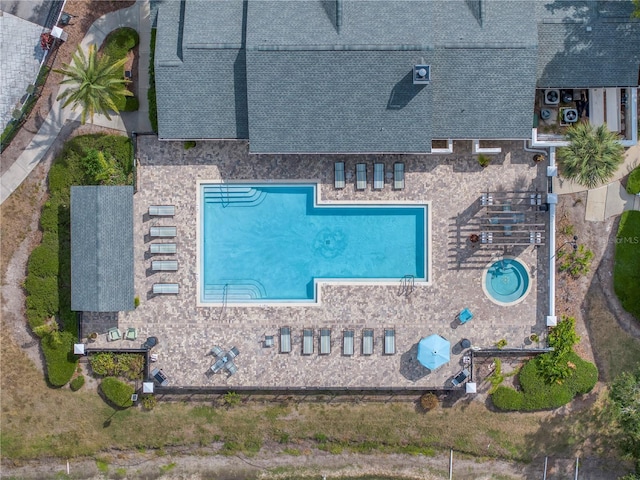 3300 Haviland Ct Unit 103, Palm Harbor, FL 34684 - aerial view of property and surrounding area featuring a pool area