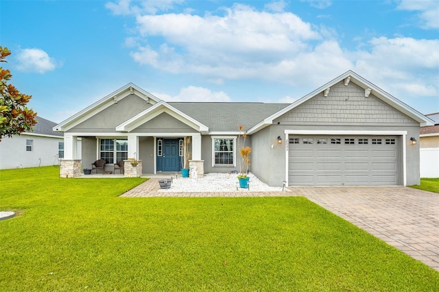 2053 Charleston Ln, Bartow, FL 33830 - craftsman-style home with an attached garage, stucco siding, a front yard, a porch, and decorative driveway
