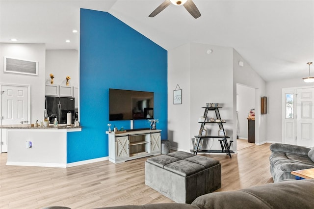 2053 Charleston Ln, Bartow, FL 33830 - living area featuring high vaulted ceiling, light wood finished floors, ceiling fan, baseboards, and recessed lighting