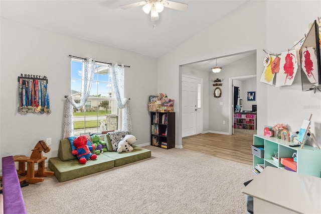 2053 Charleston Ln, Bartow, FL 33830 - living room featuring vaulted ceiling, ceiling fan, baseboards, and carpet