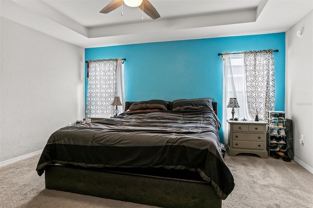 2053 Charleston Ln, Bartow, FL 33830 - carpeted bedroom featuring baseboards, a ceiling fan, and a tray ceiling