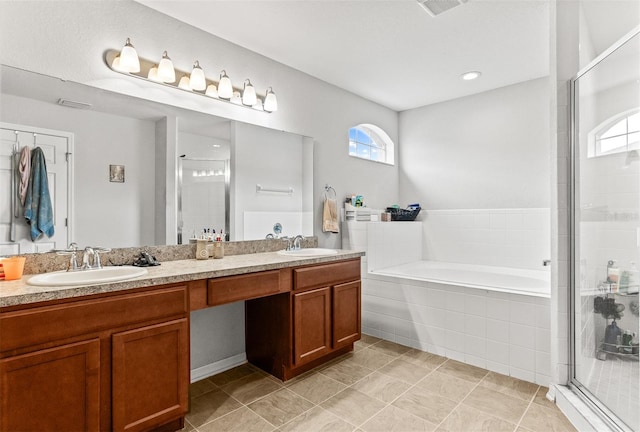 2053 Charleston Ln, Bartow, FL 33830 - bathroom featuring a garden tub, double vanity, plenty of natural light, and a shower stall