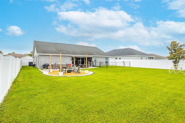 2053 Charleston Ln, Bartow, FL 33830 - back of property with a patio area and an outdoor fire pit