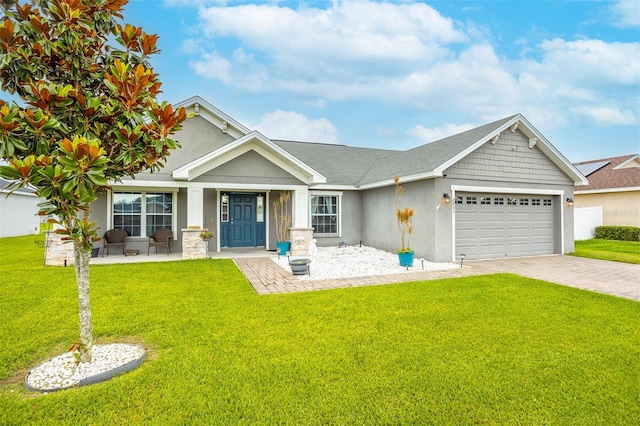 2053 Charleston Ln, Bartow, FL 33830 - view of front facade featuring a garage, stucco siding, and a front lawn