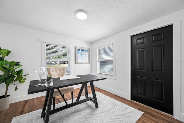 4626 8th Ave S, Saint Petersburg, FL 33711 - office with wood finished floors, baseboards, and a textured ceiling