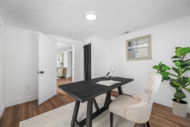 4626 8th Ave S, Saint Petersburg, FL 33711 - office area with baseboards and wood finished floors