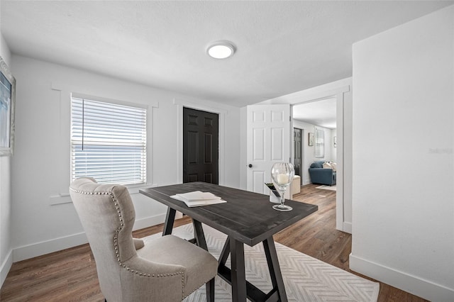 4626 8th Ave S, Saint Petersburg, FL 33711 - dining room with baseboards and wood finished floors