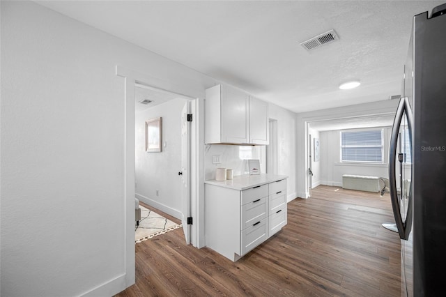 4626 8th Ave S, Saint Petersburg, FL 33711 - kitchen with freestanding refrigerator, baseboards, light countertops, and wood finished floors