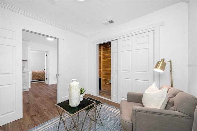 4626 8th Ave S, Saint Petersburg, FL 33711 - living area with wood finished floors, ornamental molding, and baseboards