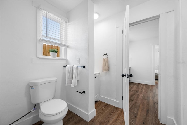 4626 8th Ave S, Saint Petersburg, FL 33711 - bathroom featuring wood finished floors, toilet, and baseboards