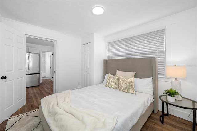 4626 8th Ave S, Saint Petersburg, FL 33711 - bedroom featuring stainless steel refrigerator, wood finished floors, and a closet