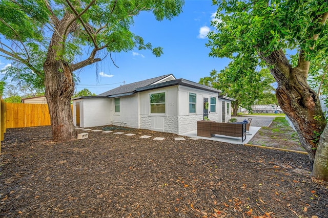 4626 8th Ave S, Saint Petersburg, FL 33711 - view of home's exterior with stone siding and a patio
