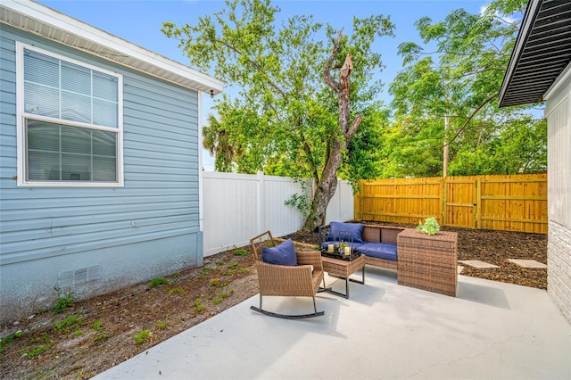 4626 8th Ave S, Saint Petersburg, FL 33711 - fenced backyard featuring a patio and an outdoor hangout area
