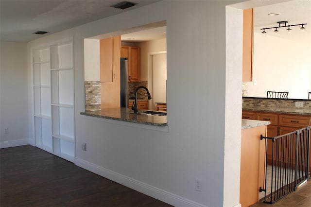 9705 45th Way N, Pinellas Park, FL 33782 - kitchen with tasteful backsplash, freestanding refrigerator, dark wood-style floors, and a sink