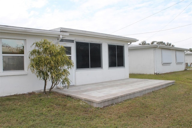 9705 45th Way N, Pinellas Park, FL 33782 - back of house featuring a patio area, stucco siding, and a yard