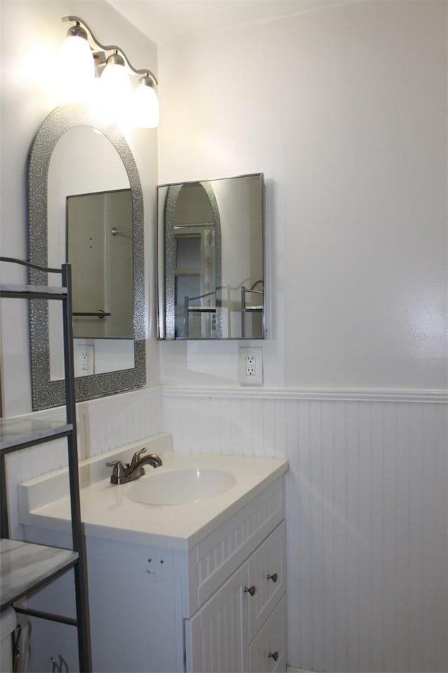9705 45th Way N, Pinellas Park, FL 33782 - bathroom featuring wainscoting and vanity