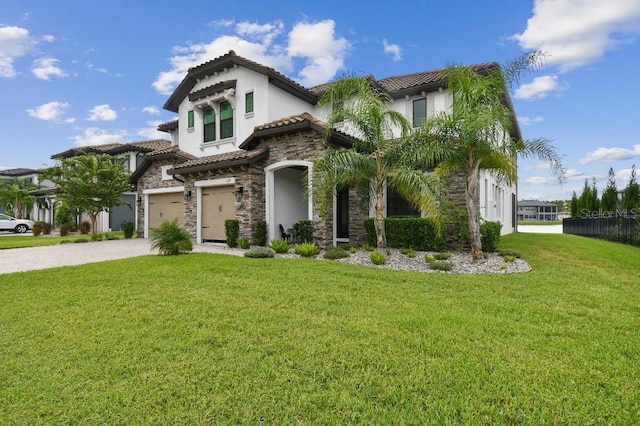 6129 Marsh Trail Dr, Odessa, FL 33556 - mediterranean / spanish house featuring stone siding, stucco siding, a tile roof, and a front yard