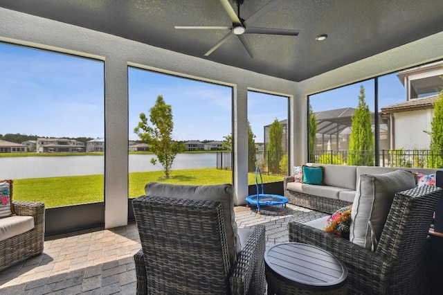 6129 Marsh Trail Dr, Odessa, FL 33556 - sunroom with an outdoor living space, a ceiling fan, a water view, and a residential view