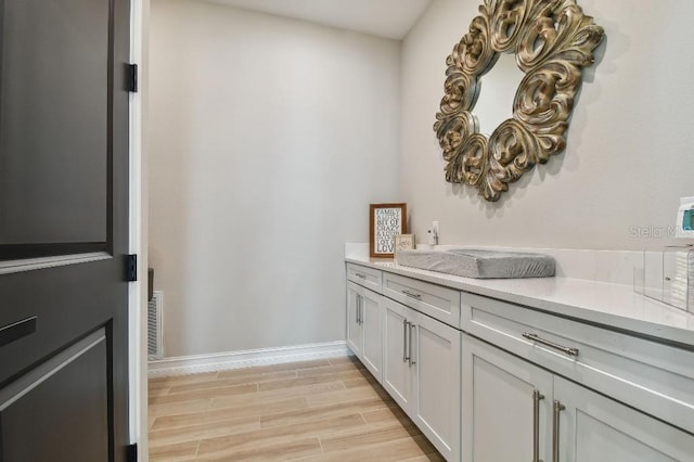 6129 Marsh Trail Dr, Odessa, FL 33556 - washroom featuring light wood-style flooring and baseboards