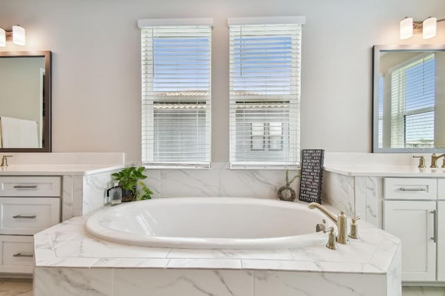 6129 Marsh Trail Dr, Odessa, FL 33556 - full bathroom featuring two vanities and a bath