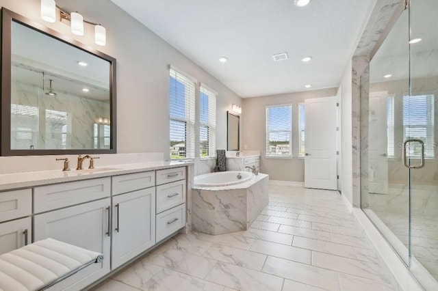 6129 Marsh Trail Dr, Odessa, FL 33556 - full bath with recessed lighting, marble look tile flooring, a marble finish shower, a garden tub, and vanity