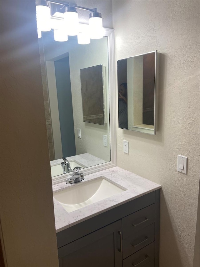2160 Corbin Pl Unit C, Palm Harbor, FL 34683 - bathroom with vanity and a textured wall