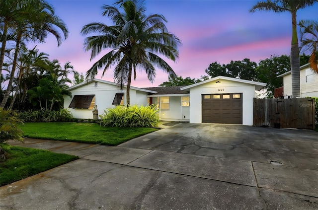 1720 Bayou Grande Blvd NE, Saint Petersburg, FL 33703 - ranch-style house featuring a garage, stucco siding, and concrete driveway
