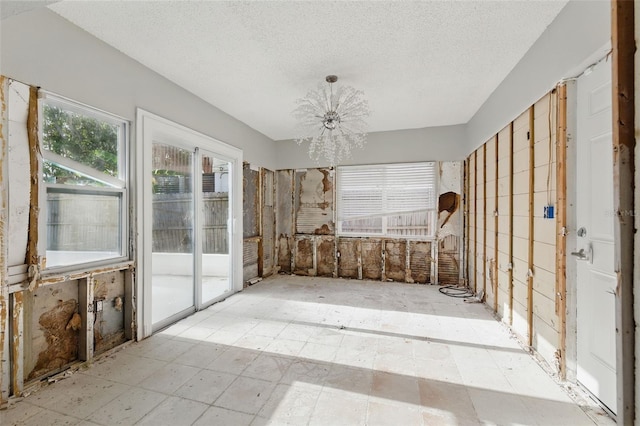 1720 Bayou Grande Blvd NE, Saint Petersburg, FL 33703 - unfurnished sunroom featuring a chandelier