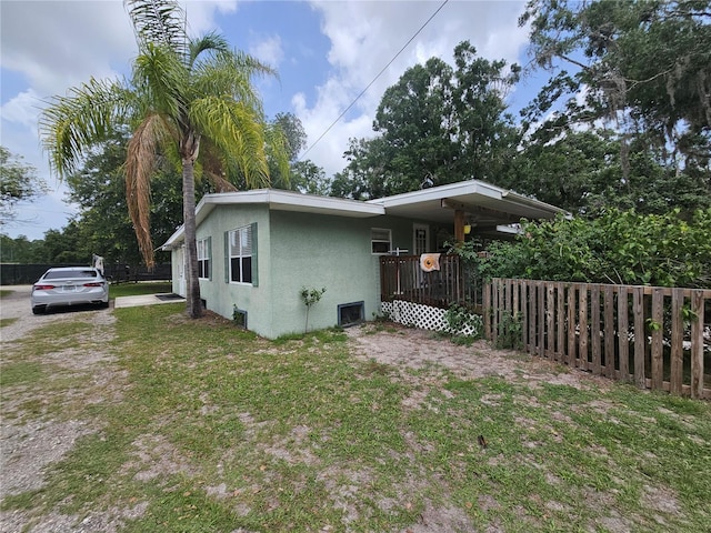 4352 Joy Dr, Land O Lakes, FL 34638 - view of home's exterior featuring stucco siding