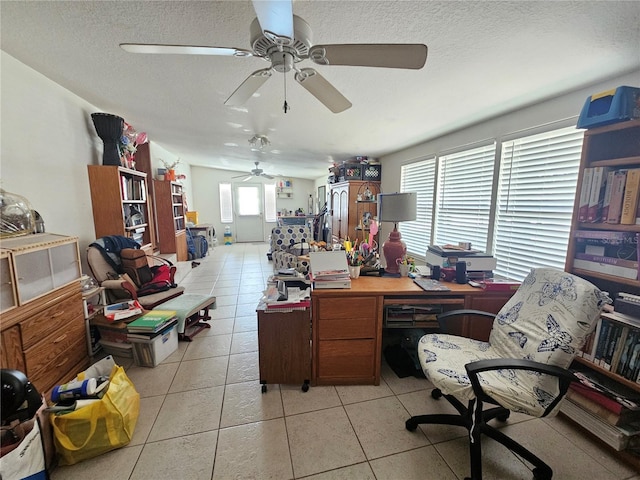 4352 Joy Dr, Land O Lakes, FL 34638 - home office featuring ceiling fan, light tile patterned flooring, and a textured ceiling