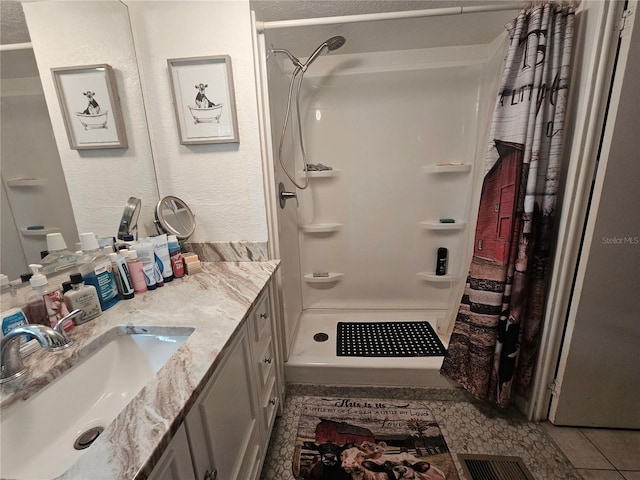4352 Joy Dr, Land O Lakes, FL 34638 - full bath with vanity, a shower stall, and a textured wall
