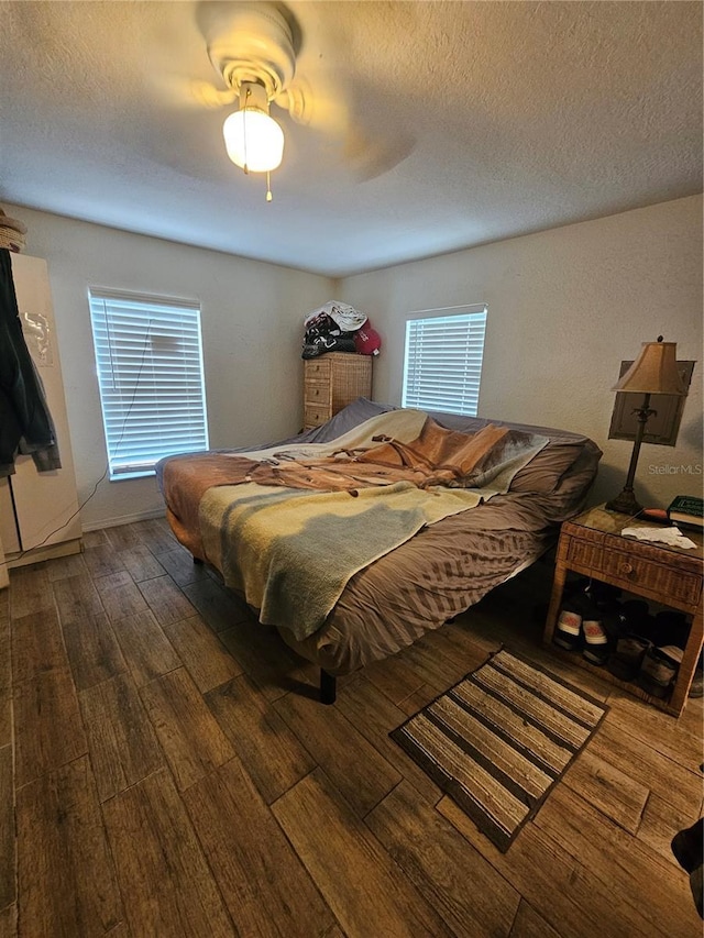 4352 Joy Dr, Land O Lakes, FL 34638 - bedroom with wood finished floors, a ceiling fan, and a textured ceiling
