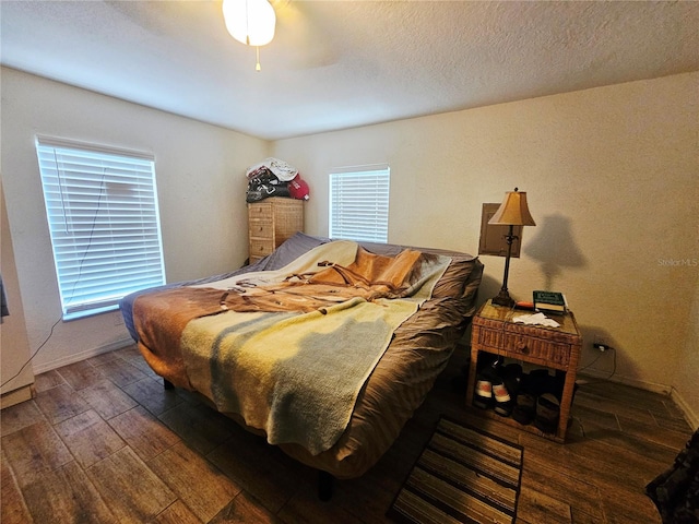 4352 Joy Dr, Land O Lakes, FL 34638 - bedroom with wood finished floors and ceiling fan
