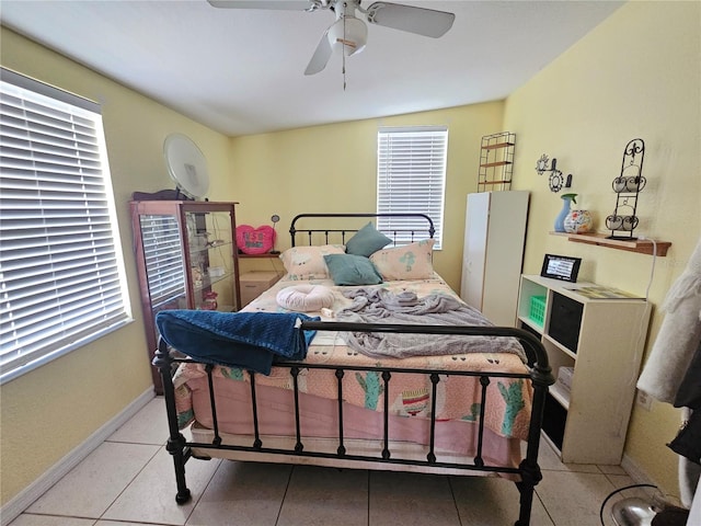4352 Joy Dr, Land O Lakes, FL 34638 - tiled bedroom featuring multiple windows and a ceiling fan