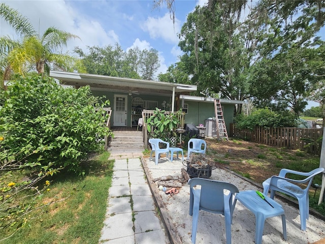 4352 Joy Dr, Land O Lakes, FL 34638 - view of patio / terrace with an outdoor fire pit