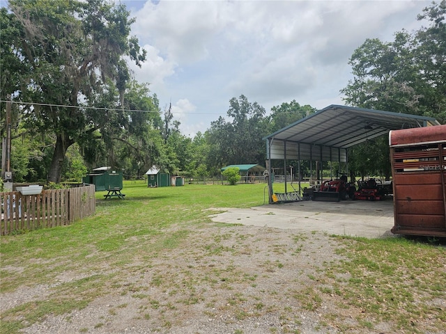 4352 Joy Dr, Land O Lakes, FL 34638 - view of yard with driveway and an outdoor structure