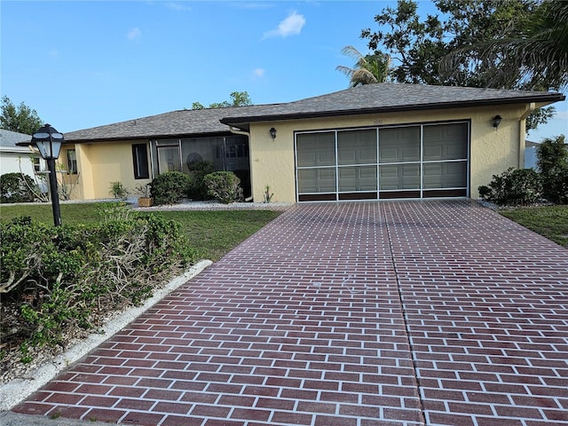 1510 Flamingo Ln, Sun City Center, FL 33573 - single story home with stucco siding, driveway, and a garage