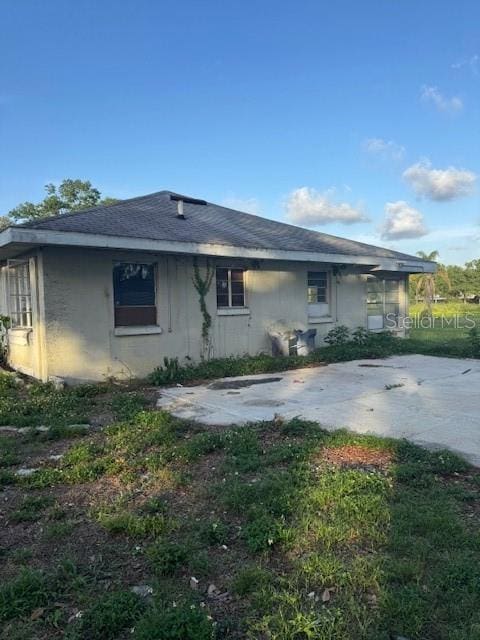 2518 Mabry St, Tampa, FL 33618 - rear view of property with roof with shingles