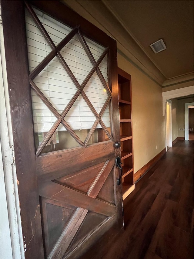 9907 Maggie St, Gibsonton, FL 33534 - detailed view of baseboards, wood finished floors, and crown molding
